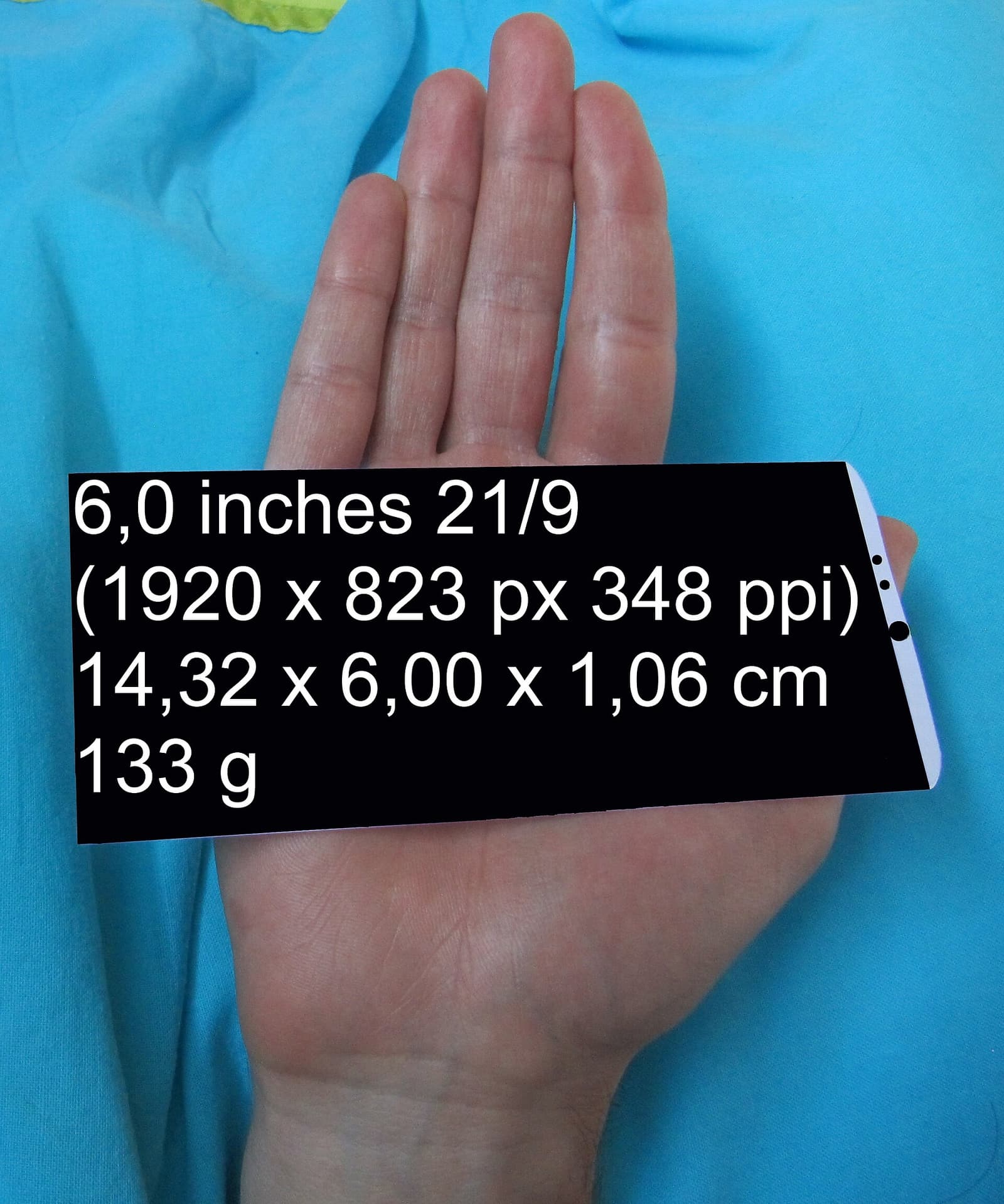 White smartphone on a hand adult